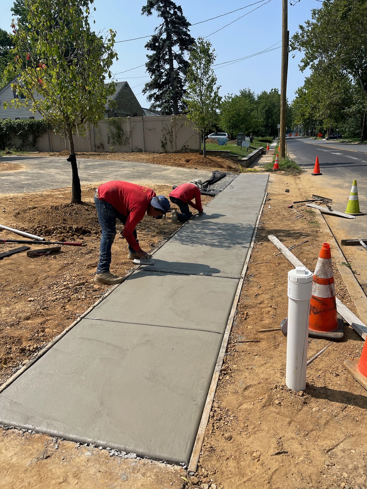 Edwards & Sons Pro crew finishing a new concrete sidewalk
