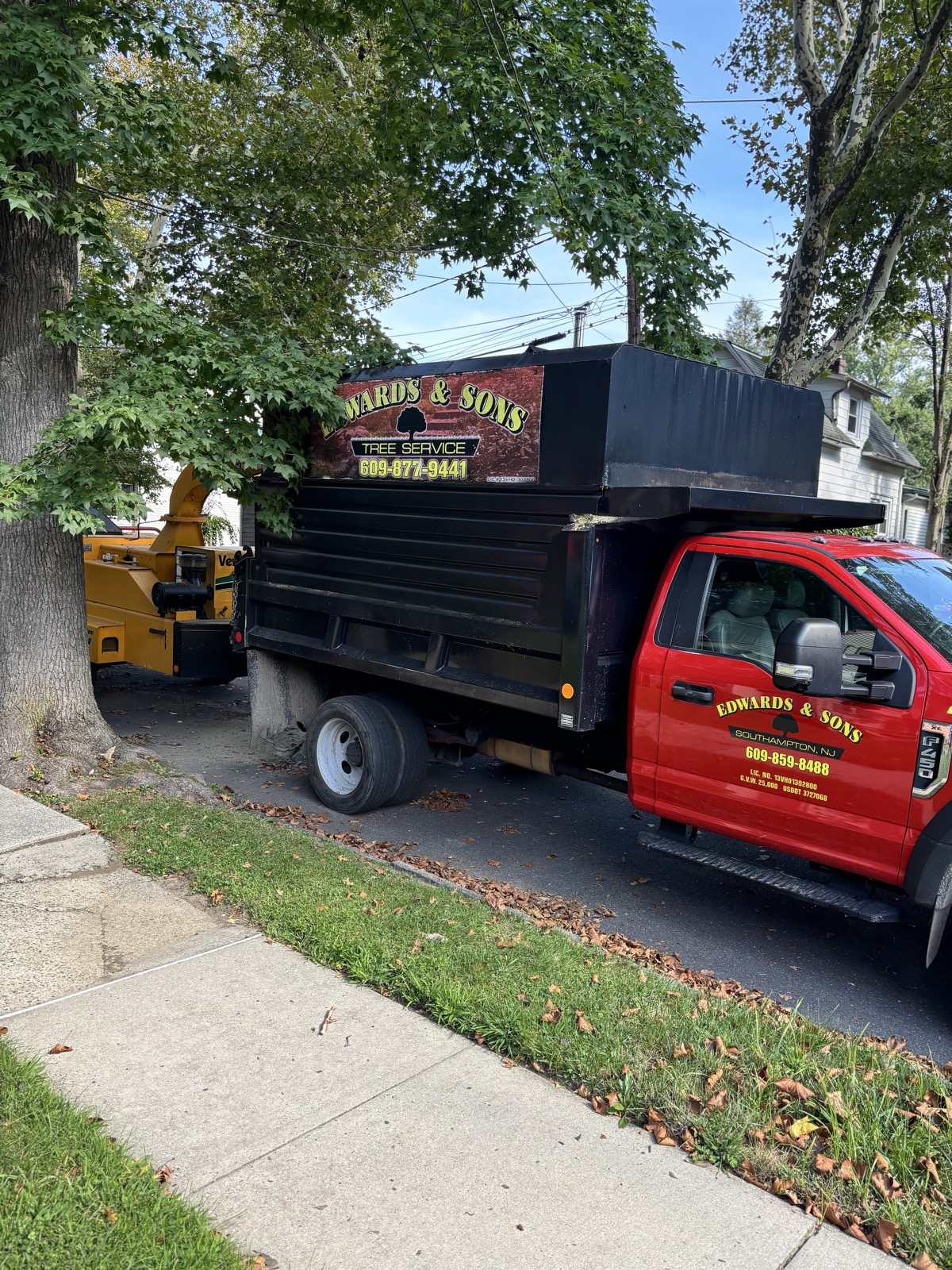 Edwards & Sons Pro chipper truck on a job site